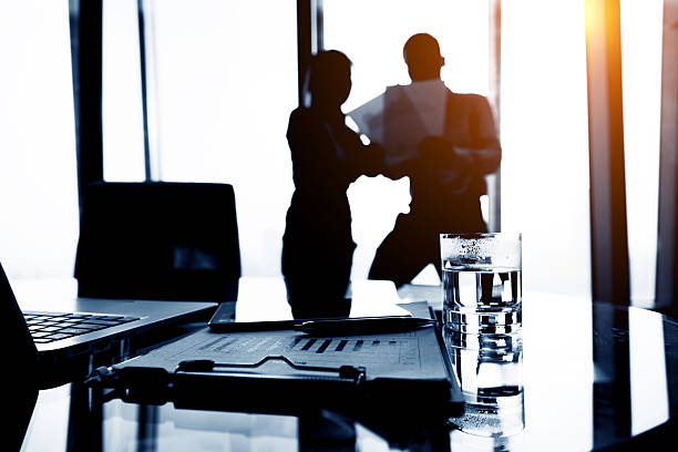 istock Two business people discussing at office 638035114
