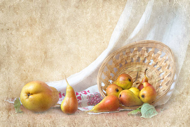 istock Yellow pear with red barrels on a straw plate 638035896