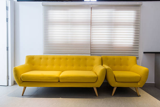 istock Modern yellow sofa and chair in room interior at home 638036274