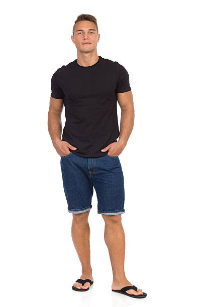istock Cheerful Handsome Man In Jeans Shorts And Slipers 638036282