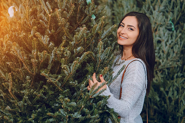 istock girl and Christmas tree 638036560