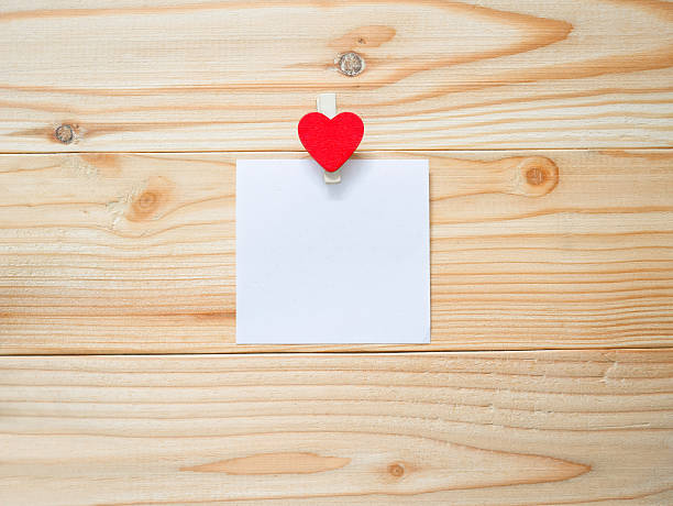 istock Red heart shaped peg and blank paper 638039150