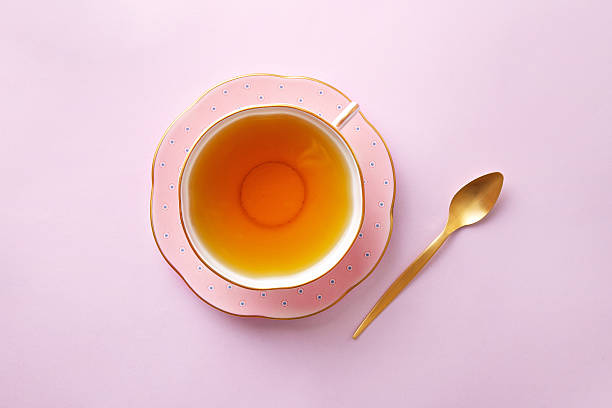 istock Tea cup on pastel pink background. Top view 638040072
