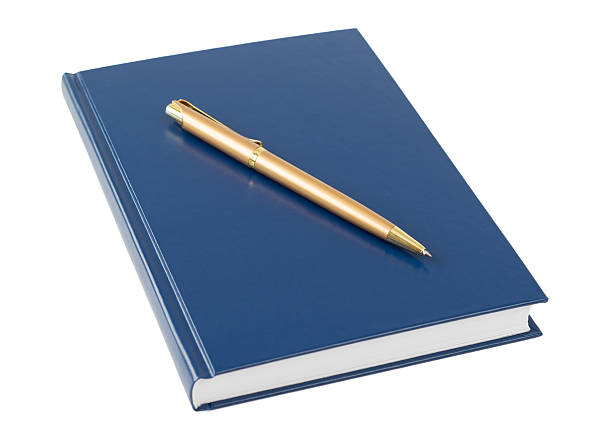 istock Blue notebook with a gold pen isolated on white background. 638042142