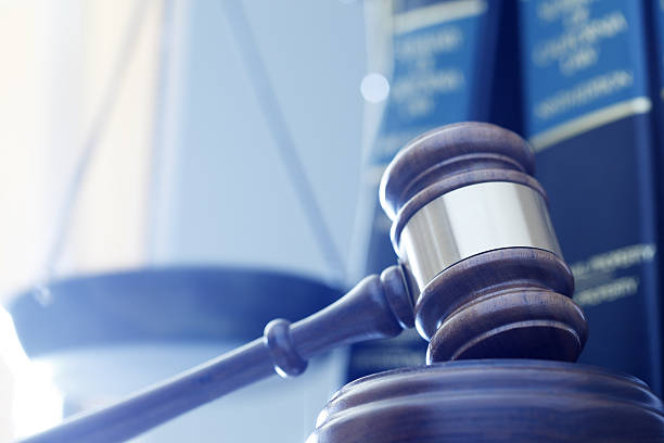 istock Gavel In Front Of Justice Scale And Law Books 638044582