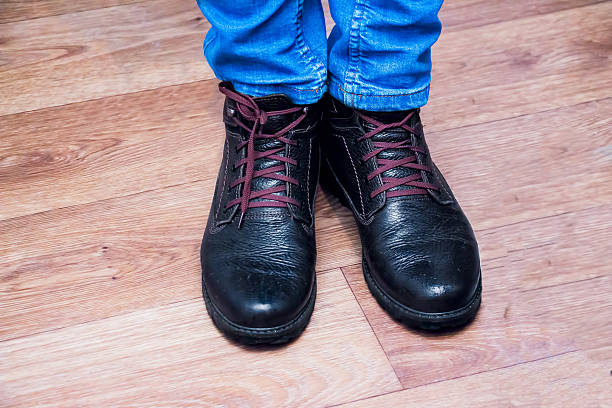 istock Legs mens in jeans and boots 638045544