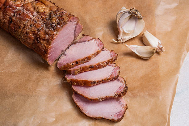 istock View of sliced smoked meat or ham and garlic 638045610