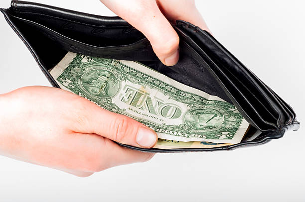 istock Holding in hands open wallet with money in it 638046144