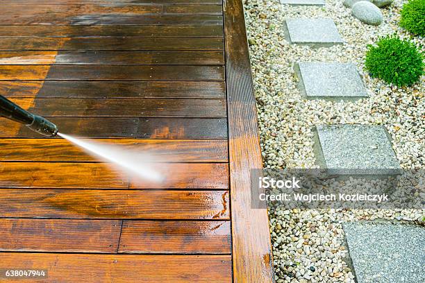 Cleaning Terrace With A Pressure Washer Stock Photo - Download Image Now - Deck, Cleaning, Outdoors