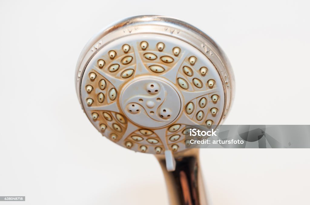 Dirty shower head with limescale and rust on it Shower Stock Photo