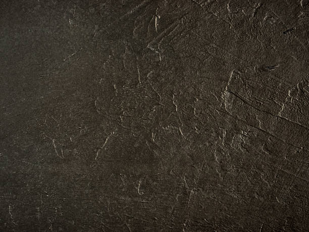 istock Dark grunge textured wall closeup 638049434
