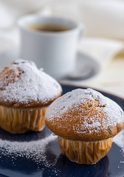 istock Breakfast with muffins sprinkled by powder sugar and coffee. 638050352