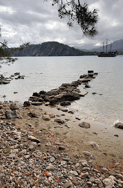 Turkish gulet or schooner-southernmost Sun or Protected Harbour-the ancient city of Phaselis loaded with tourists cruising the shoreline from Antalya to the ports of the south. Antalya prov.-Turkey.