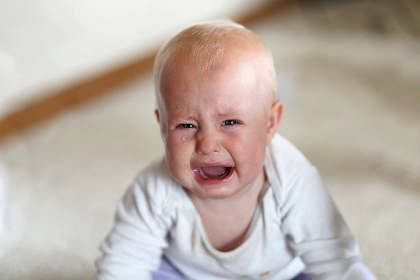 Little girl crying. Really upset. Tears on her cheek. Girl portrait