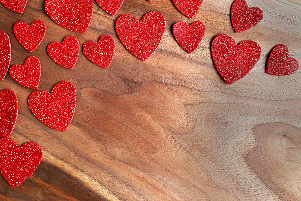 red sparkle valentine's hearts frame cherry wood background - cherry valentine stok fotoğraflar ve resimler