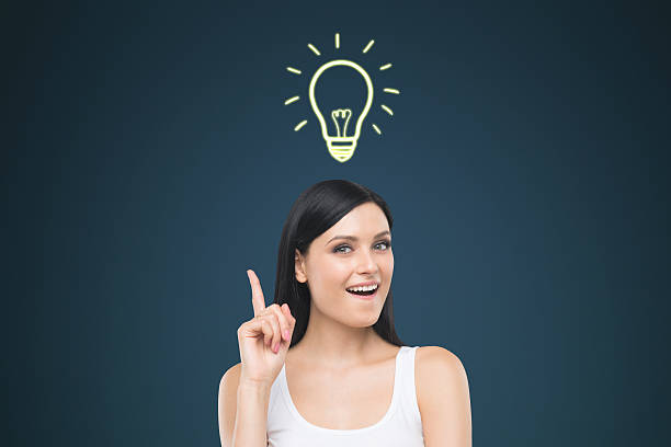 istock Woman in tank top and floating light bulb 638058168
