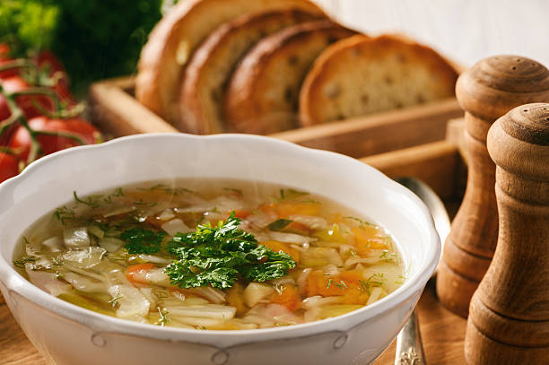 istock Vegetable soup with bread on wooden tray. 638060732