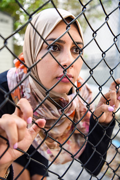 istock Sad refugee Middle eastern woman (Real People) 638060828