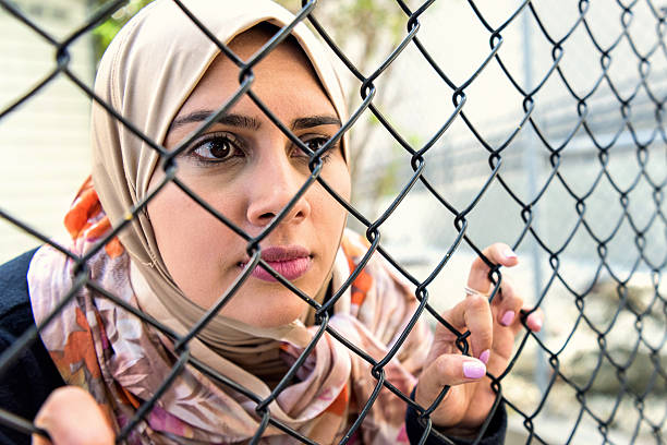 istock Sad refugee Middle eastern woman (Real People) 638060848