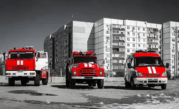 red fire engines on black white photo