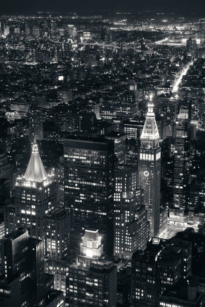 New York City historical skyscrapers New York City historical skyscrapers and urban cityscape at night. new york life building stock pictures, royalty-free photos & images