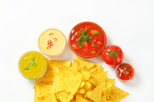 Arranged nachos with different dips
