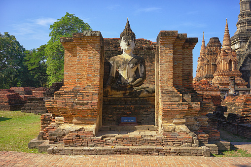 Ancient Buddha statue in lotus position at Yai Chai Mongkhon temple. Ayutthaya. Phra Nakhon Si Ayutthaya province. Thailand.
