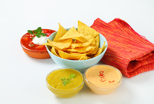Arranged nachos with different dips