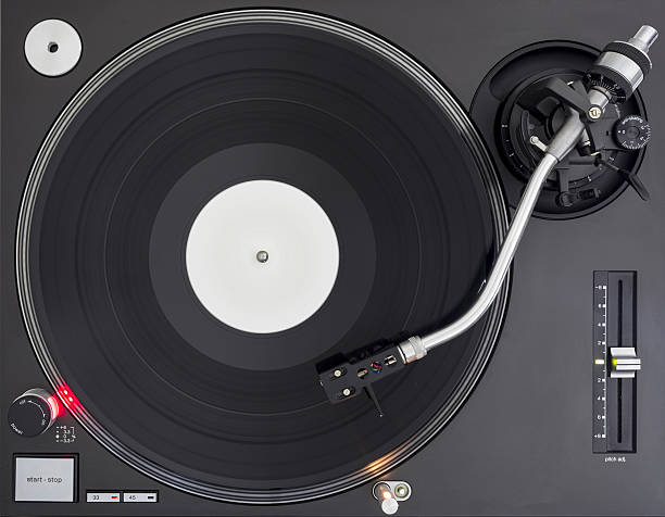 istock DJ Turntable with Vinyl Record, Playing, Top View 638063080