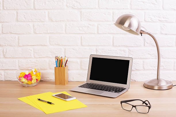 istock Wooden designer desktop with laptop 638064364
