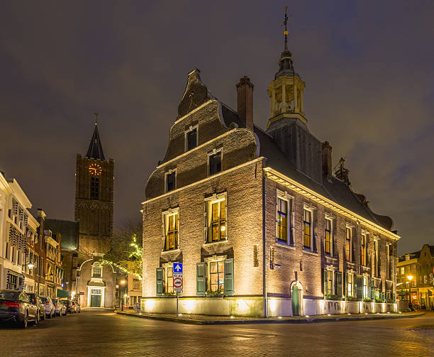 Dutch city Schiedam town hall and church at night stock photo