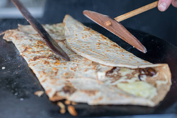 istock Cooking Crepe on Skillet Being Folded 638067582
