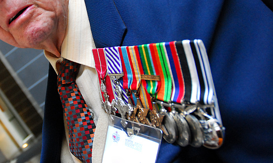 Auckland, New Zealand - April 25, 2007: A second world war (World War two) veteran displays his war medals during an ANZAC Day memorial service in Auckland, New Zealand.