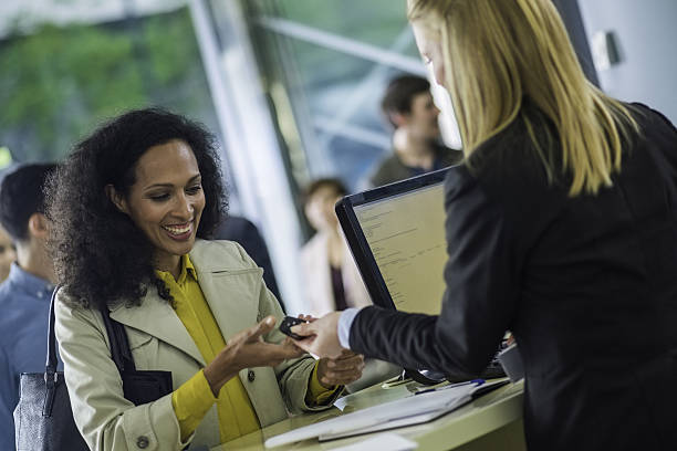 istock Car rental employee giving keys to customer 638070190