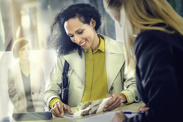 Hispanic lady at an insurance agency counter