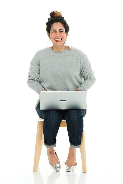 istock Cheerful woman working on laptop 638072492