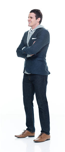 istock Smiling man standing with arms crossed 638073196