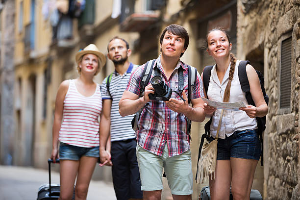 istock Couples with baggage walking the city 638074348