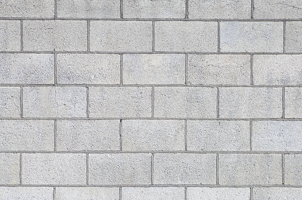 bloque de hormigón pared y textura de fondo sin costuras - bloque de cemento fotografías e imágenes de stock