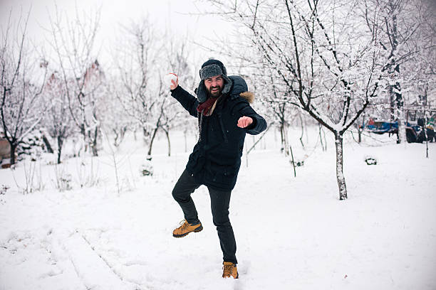 istock Bearded guy is about to throw snowball 638078766