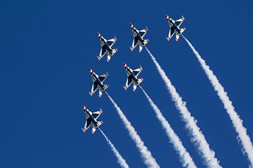 Huntington Beach, California,USA- October 22,2016. US Air Force Thunderbirds F-16 jet fighters performing at 2016 Huntington Beach Air Show in Southern California. The 2016 Huntington Beach Air Show features military aircraft and the US Air Force Thunderbirds performing free to the public.