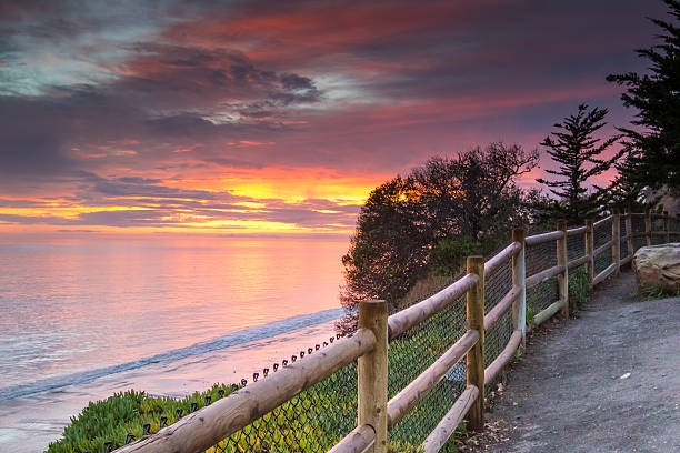 Beautiful Sunset with Fence Pacific ocean sunset near Santa Barbara santa barbara california stock pictures, royalty-free photos & images