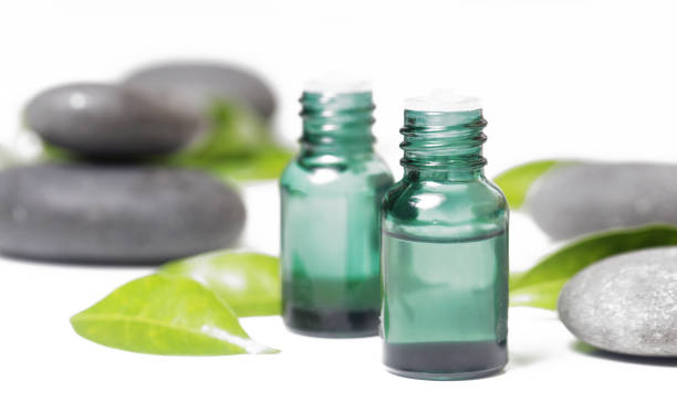 istock Green cosmetic bottles with zen stones 638085578