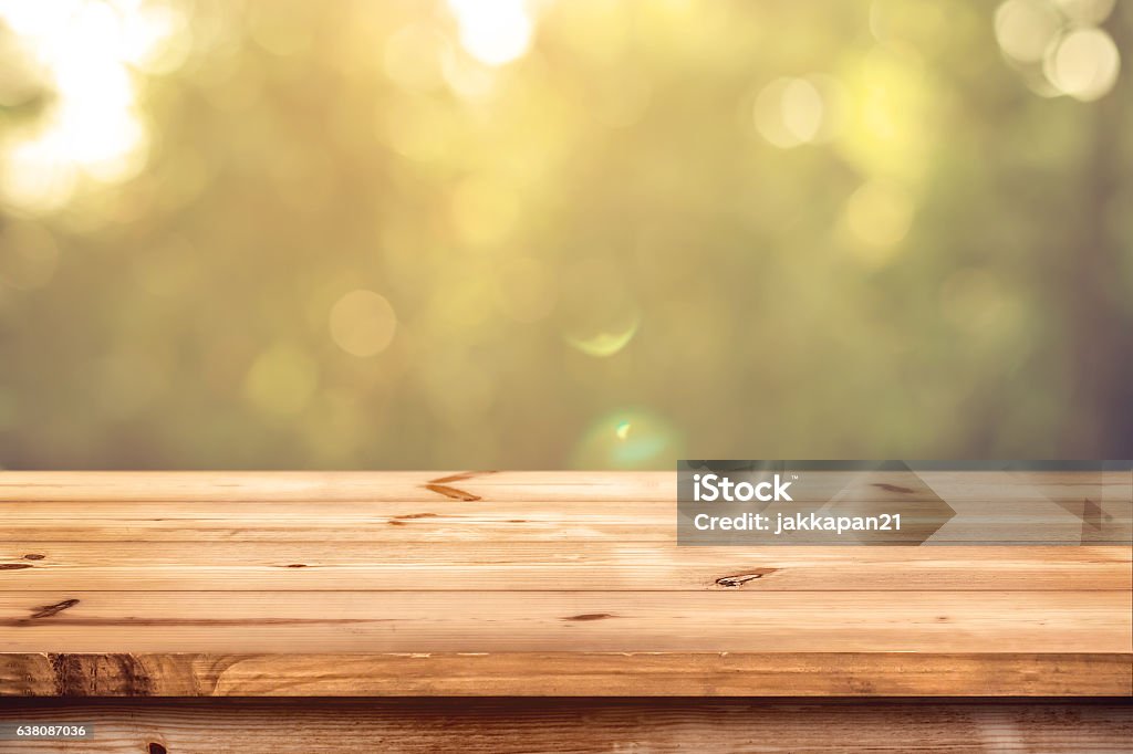 wood table in park Top of wood table with blurred bokeh nature background - Empty ready for your product display montage. Table Stock Photo