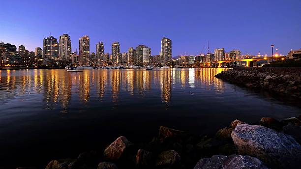 istock Night city lights reflections in calm water. 638087688