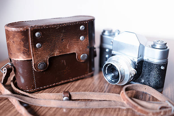 istock Vintage rangefinder camera with leather cover case background 638087736