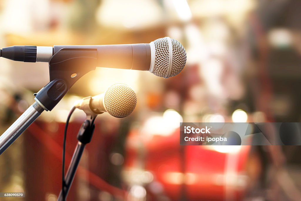 Microphone on concert stage background Outdoors Stock Photo