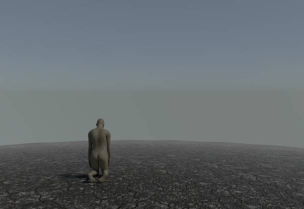 istock One man kneeling in a desert with cracked soil 3d 638092398