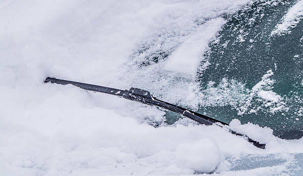 istock Cleaning car windshield of snow 638092432