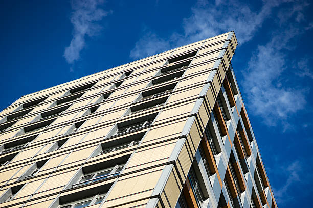 istock Diagonal city living building with blue sky background 638098586